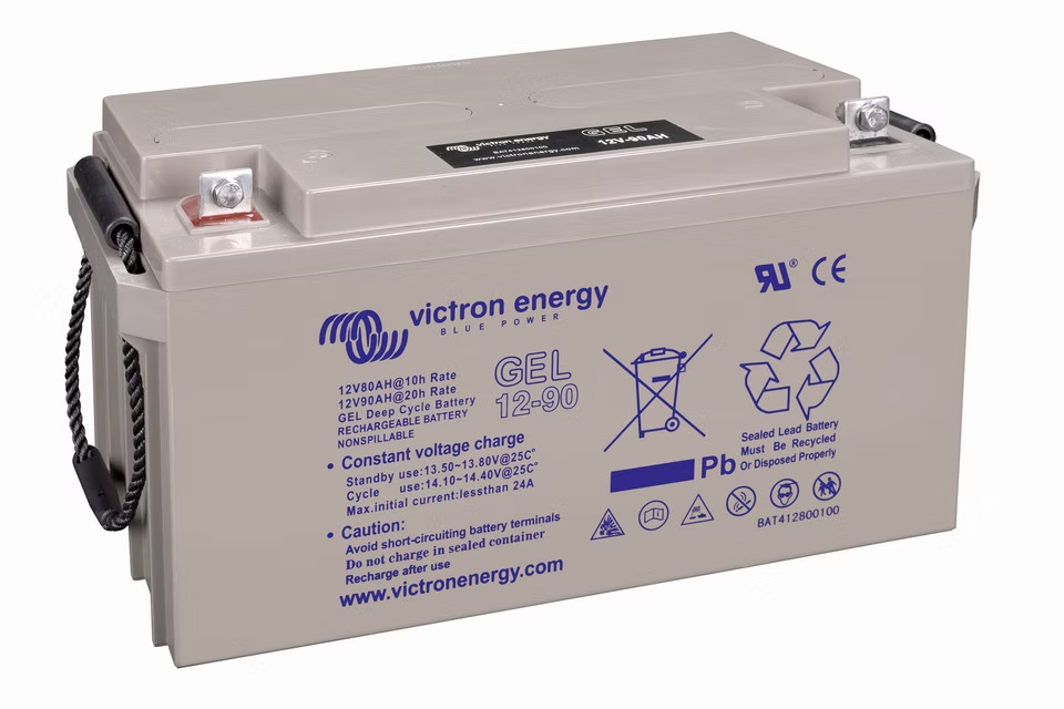 Gel batteries replace liquid electrolyte with silica-gelled acid. The gassing that provides relief in flooded cells damages the gel matrix instead, creating voids that permanently reduce capacity. Gel cells carry a lower voltage ceiling than FLA or AGM, typically 14.0 to 14.2V for a 12V bank. Tighter ceiling, zero gassing tolerance, no exemption. A charge controller is required and must be configured for gel chemistry specifically. A controller set up for flooded lead-acid will overcharge a gel battery.
